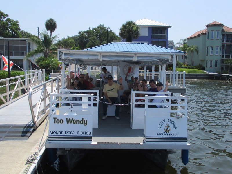 Guests excited and waving as they get ready for a Shoreline Tour on the boat Too Wendy