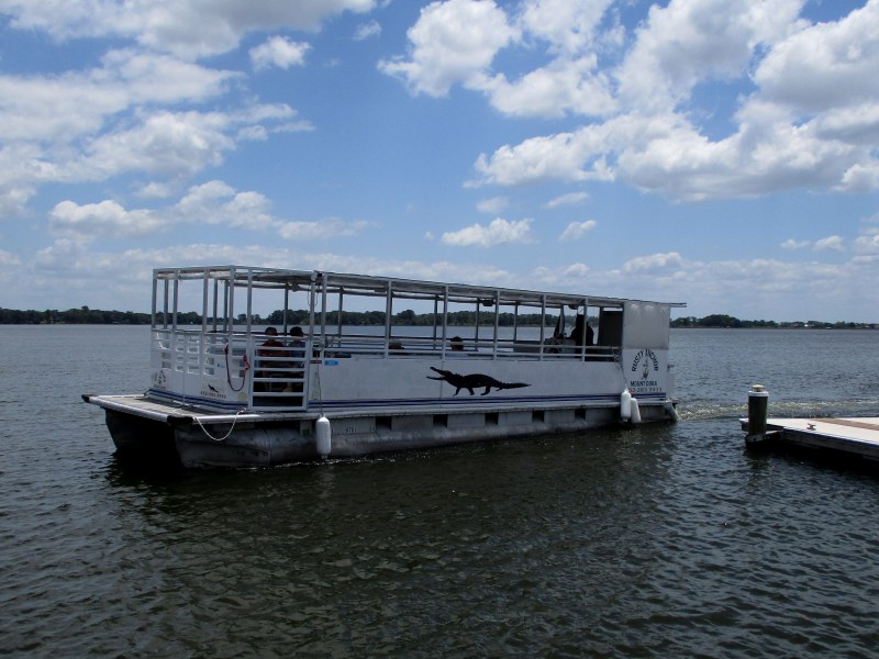 Rusty Anchor Mount Dora tour boat named Tiki coming into the dock