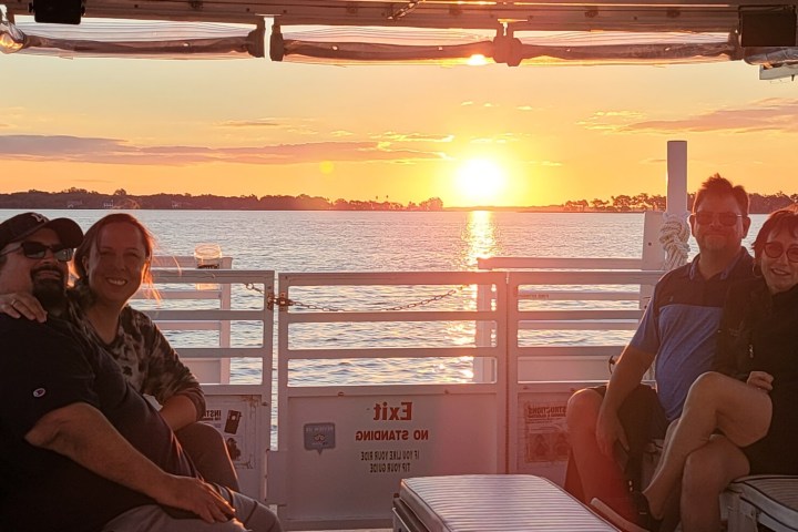 People on Rusty Anchor Mount Dora Sunset Dinner Cruise a pier